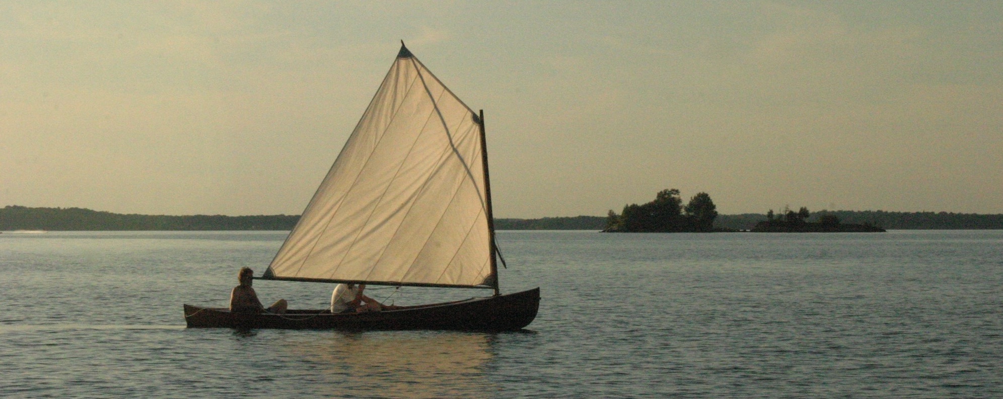 Sailing skiff with Copperas Island in the background